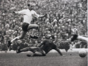 Sport. Football. British Championship (European Championship Qualifier). Cardiff. 21st October 1967. Wales 0 v England 3. England's Bobby Charlton leaps high to avoid a challenge as the ball runs free.
